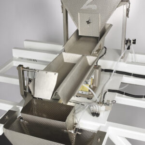 84.- Envasado con bandeja vibratoria